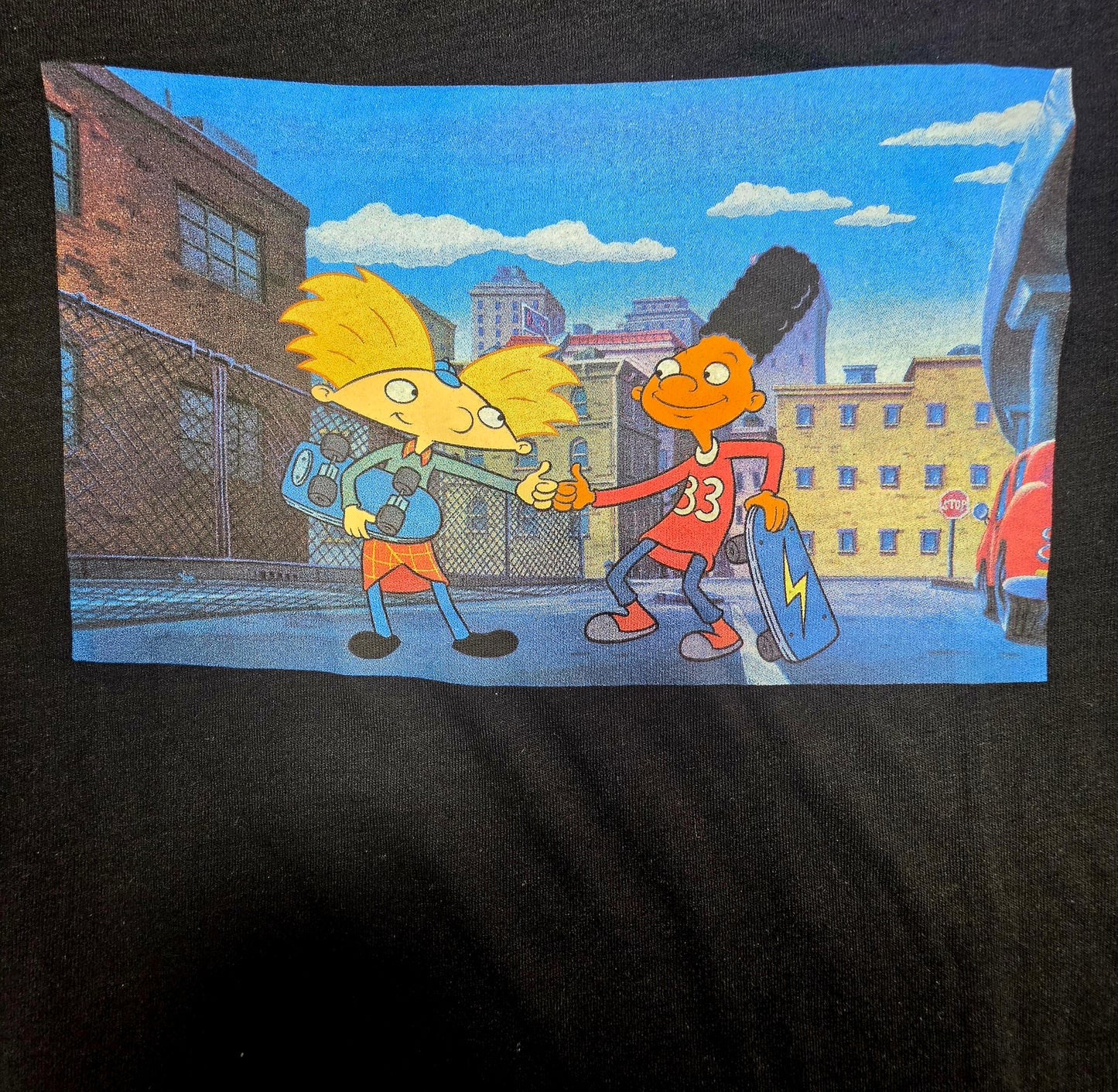 This is a Nickelodeon Hey Arnold! graphic t-shirt featuring Arnold and Gerald shaking hands.